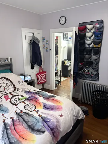 a bedroom with a bed and a dresser