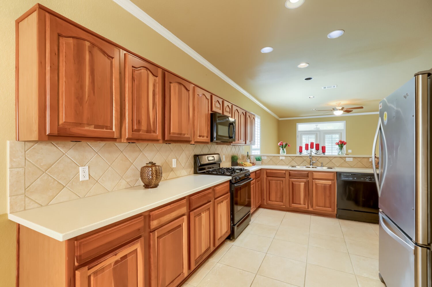 310 Crockett Loop Georgetown, TX 78633 - Photo 5 of 22 Lots of counter space and beautiful cherry wood cabinets in the kitchen.