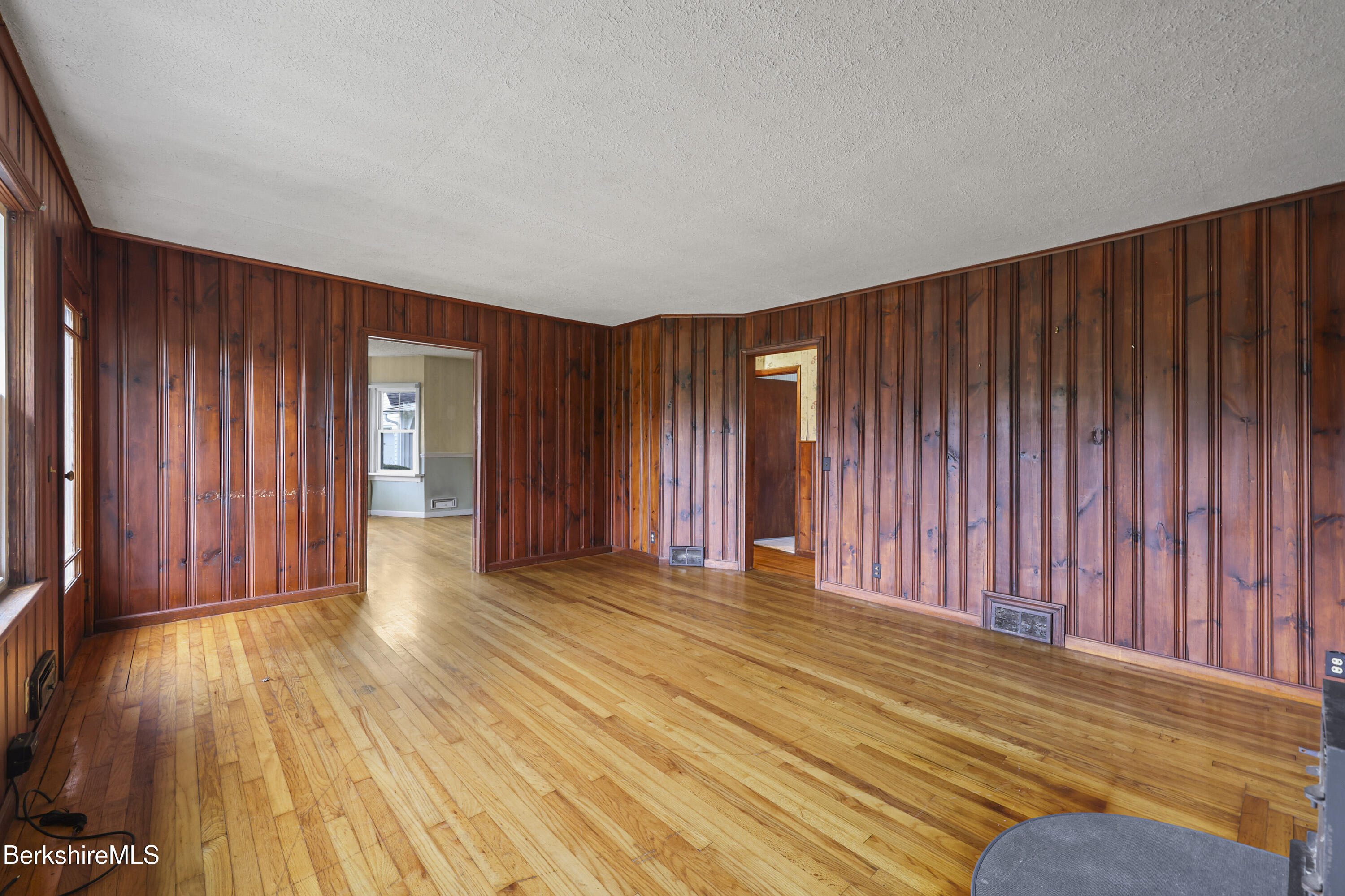 399 State Road Richmond, MA 01201 - Photo 11 of 43 a view of a livingroom with wooden floor and furniture