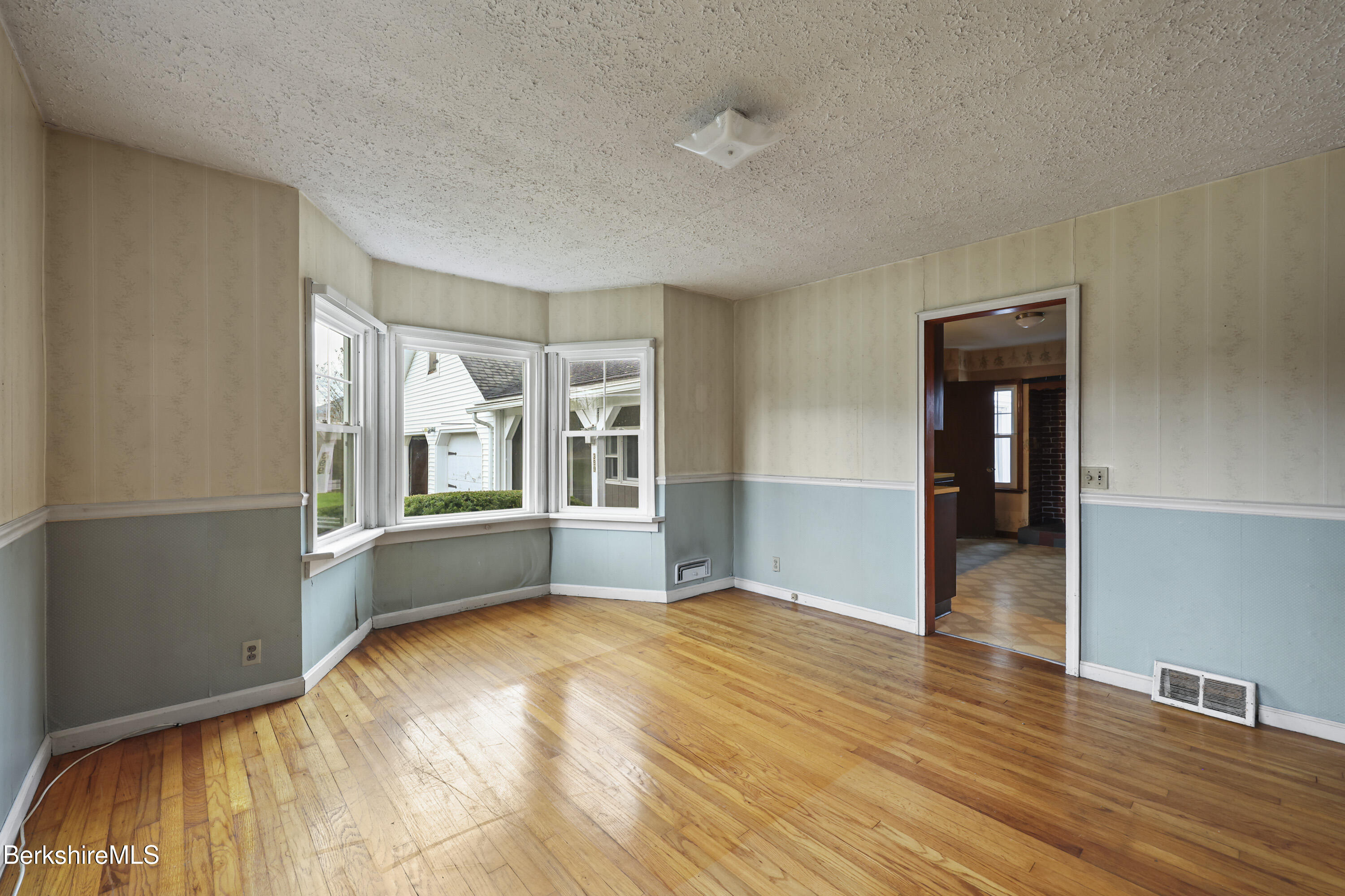 399 State Road Richmond, MA 01201 - Photo 13 of 43 a bedroom with wooden floor and large window