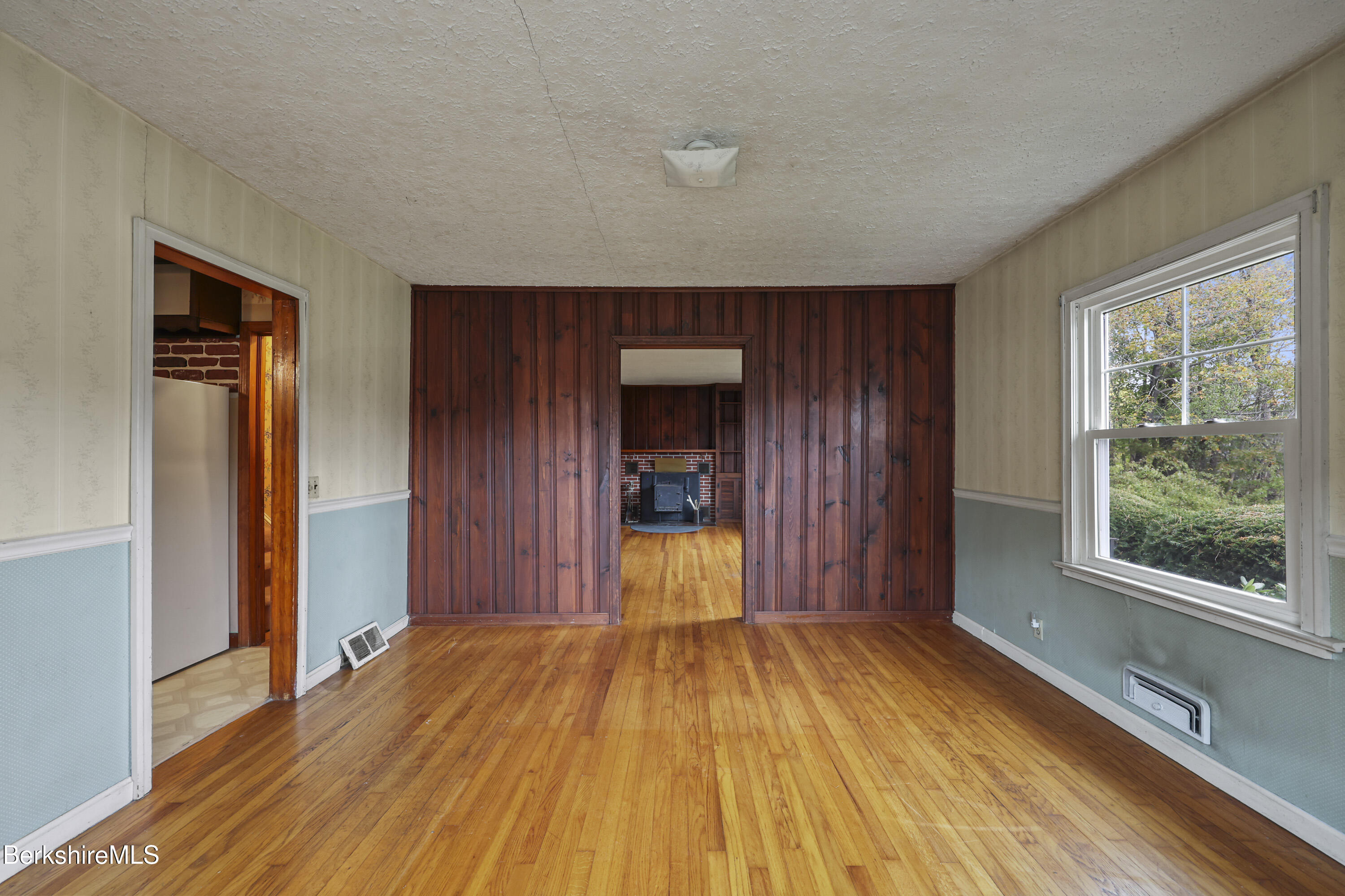 399 State Road Richmond, MA 01201 - Photo 16 of 43 a view of a room with wooden floor and a window