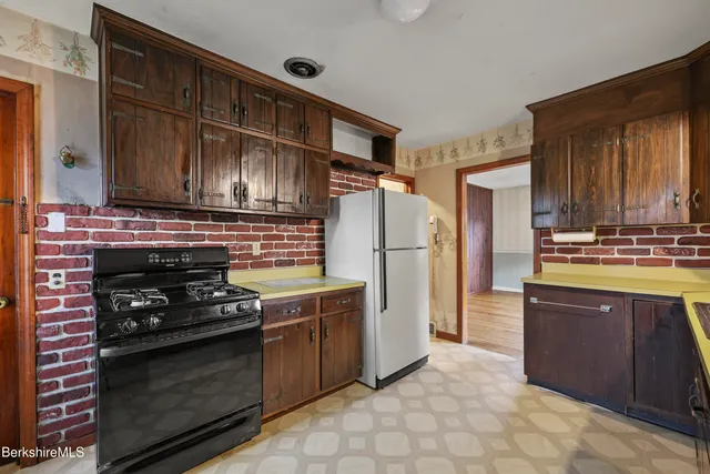 a spacious bathroom with a granite countertop sink and a mirror