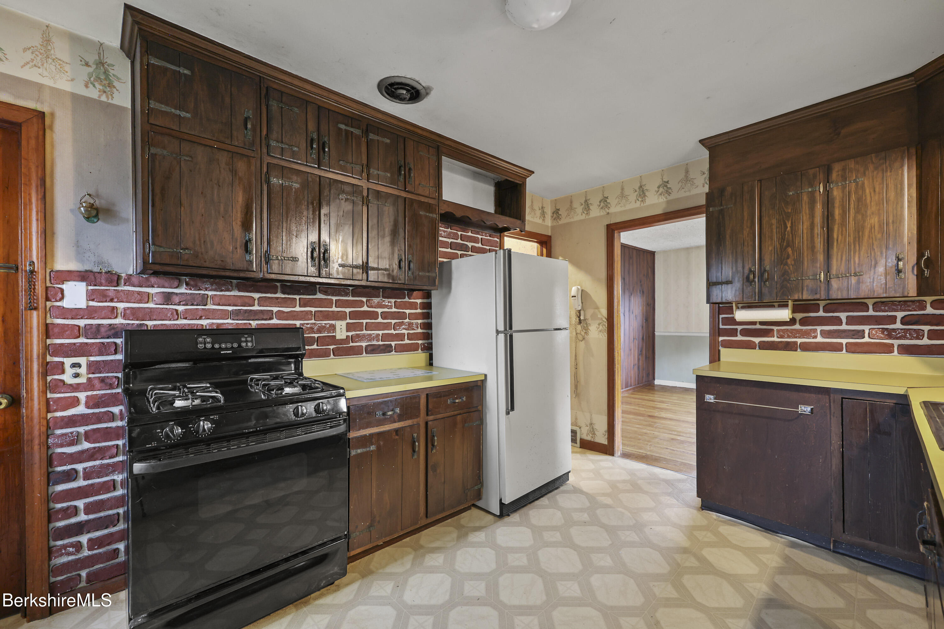 399 State Road Richmond, MA 01201 - Photo 18 of 43 a kitchen with granite countertop a stove and a refrigerator