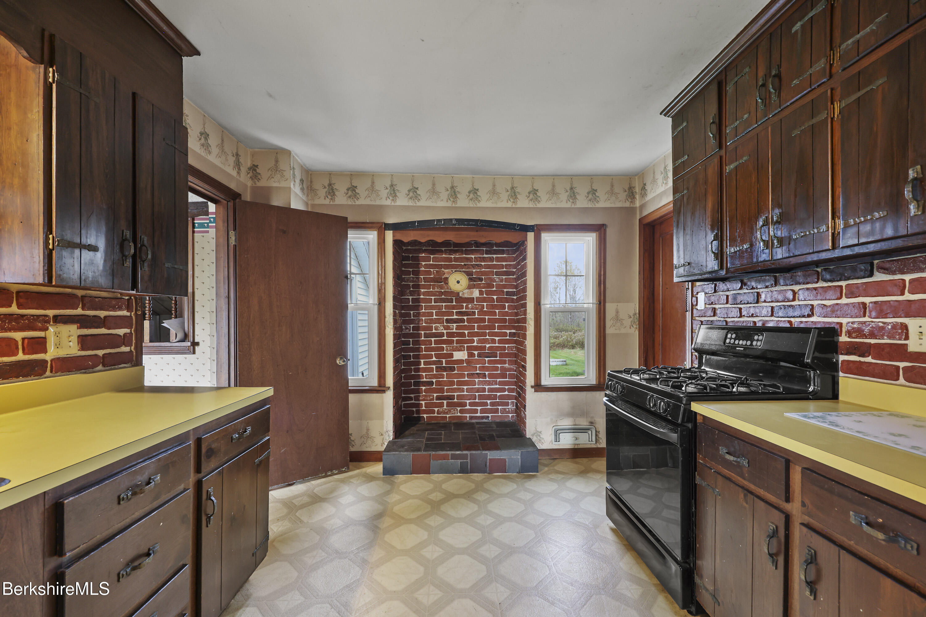 399 State Road Richmond, MA 01201 - Photo 20 of 43 a kitchen with a stove a sink and a refrigerator