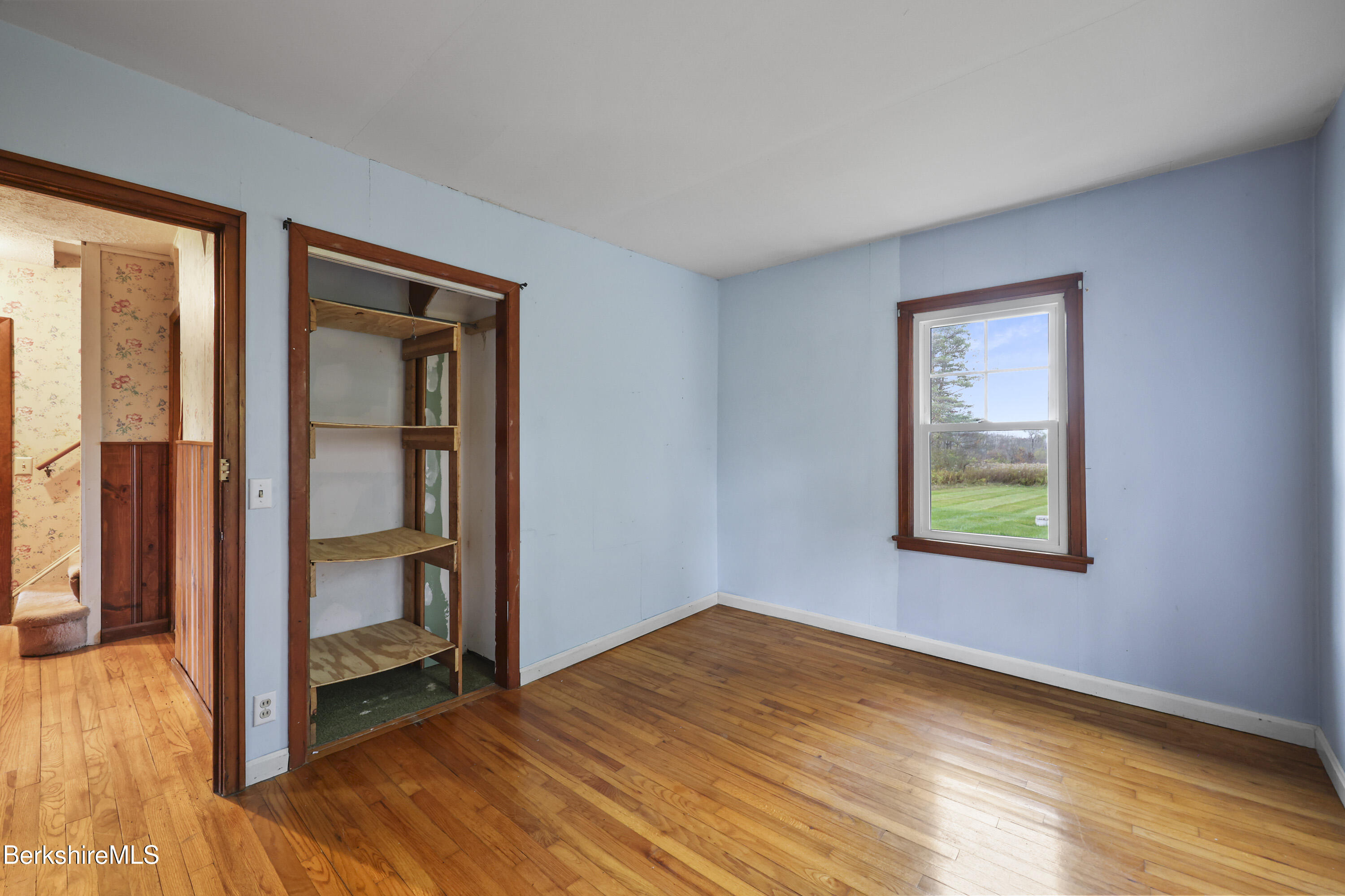 399 State Road Richmond, MA 01201 - Photo 23 of 43 a view of empty room with wooden floor and fan