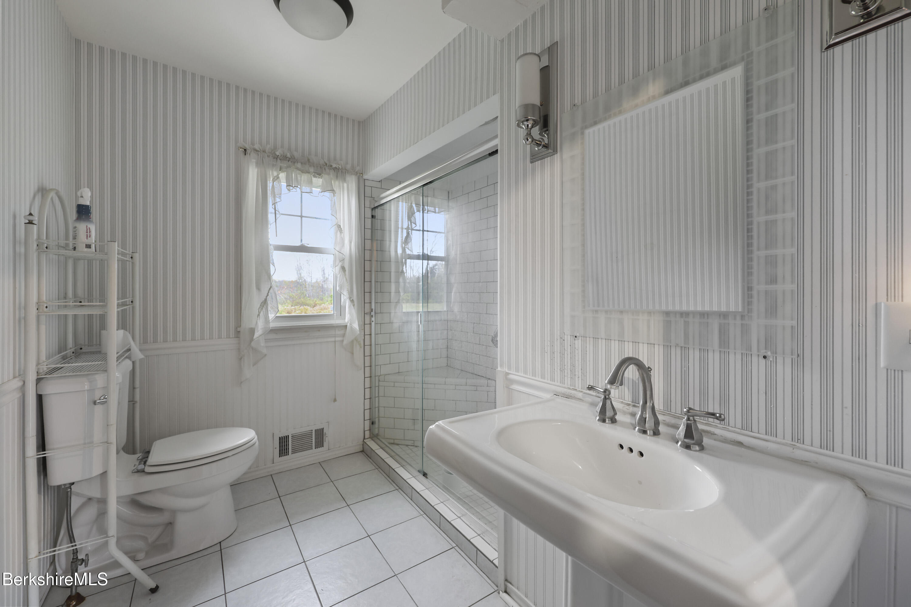 399 State Road Richmond, MA 01201 - Photo 25 of 43 a bathroom with a granite countertop sink a toilet and a mirror