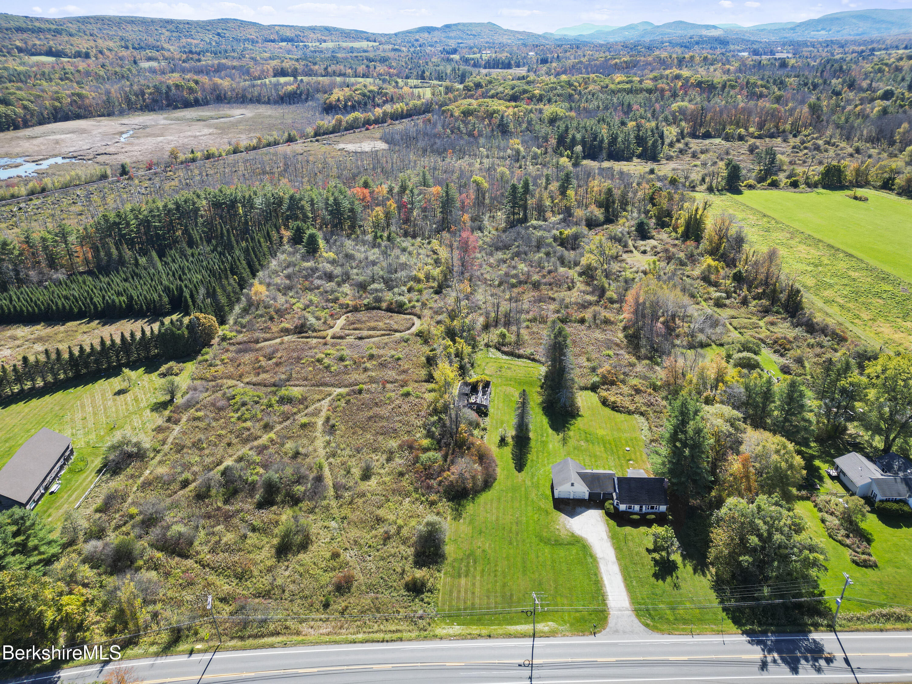 399 State Road Richmond, MA 01201 - Photo 3 of 43 an aerial view of a houses with a yard