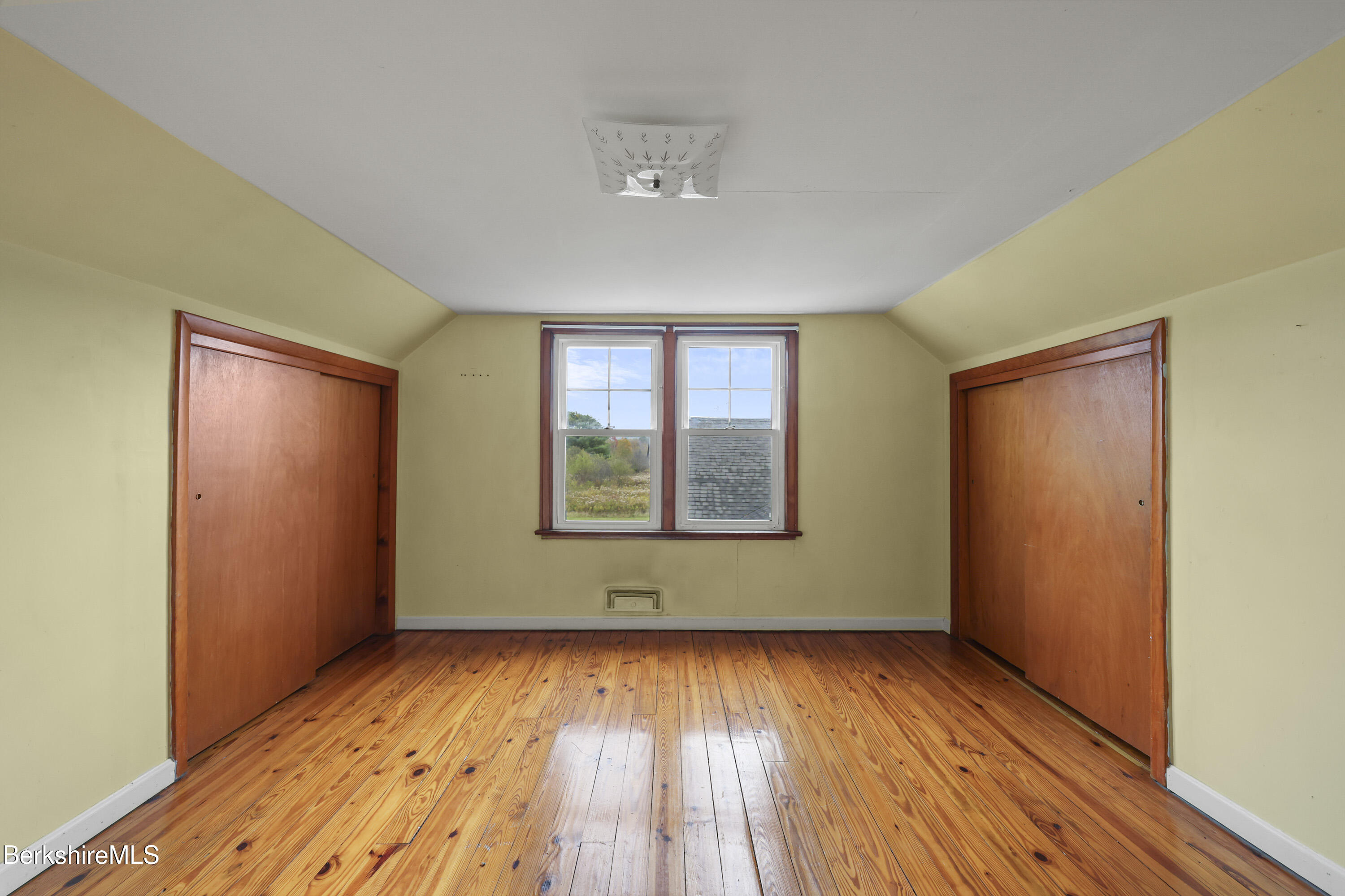 399 State Road Richmond, MA 01201 - Photo 31 of 43 an empty room with wooden floor and windows