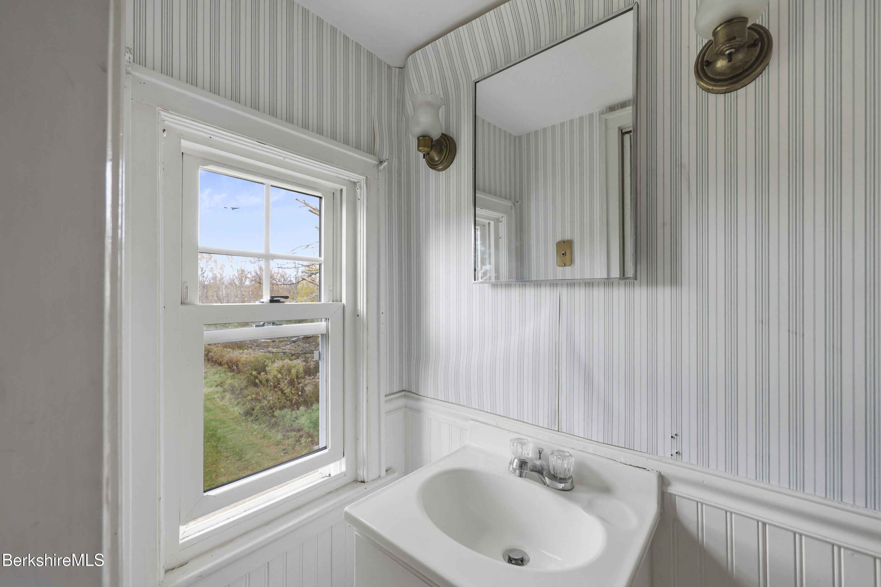 399 State Road Richmond, MA 01201 - Photo 33 of 43 a bathroom with a sink and a mirror