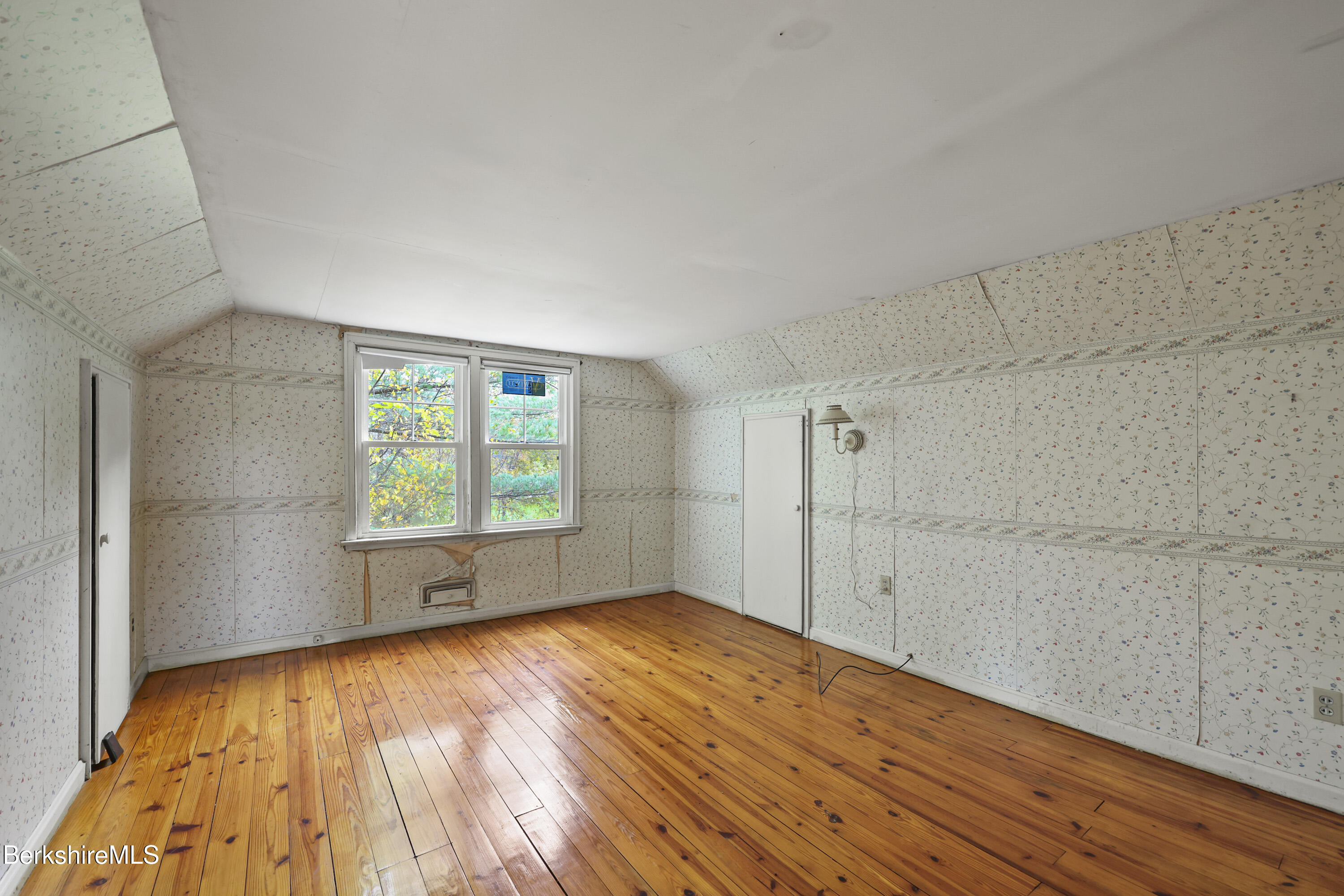 399 State Road Richmond, MA 01201 - Photo 34 of 43 a view of an empty room with wooden floor and a window