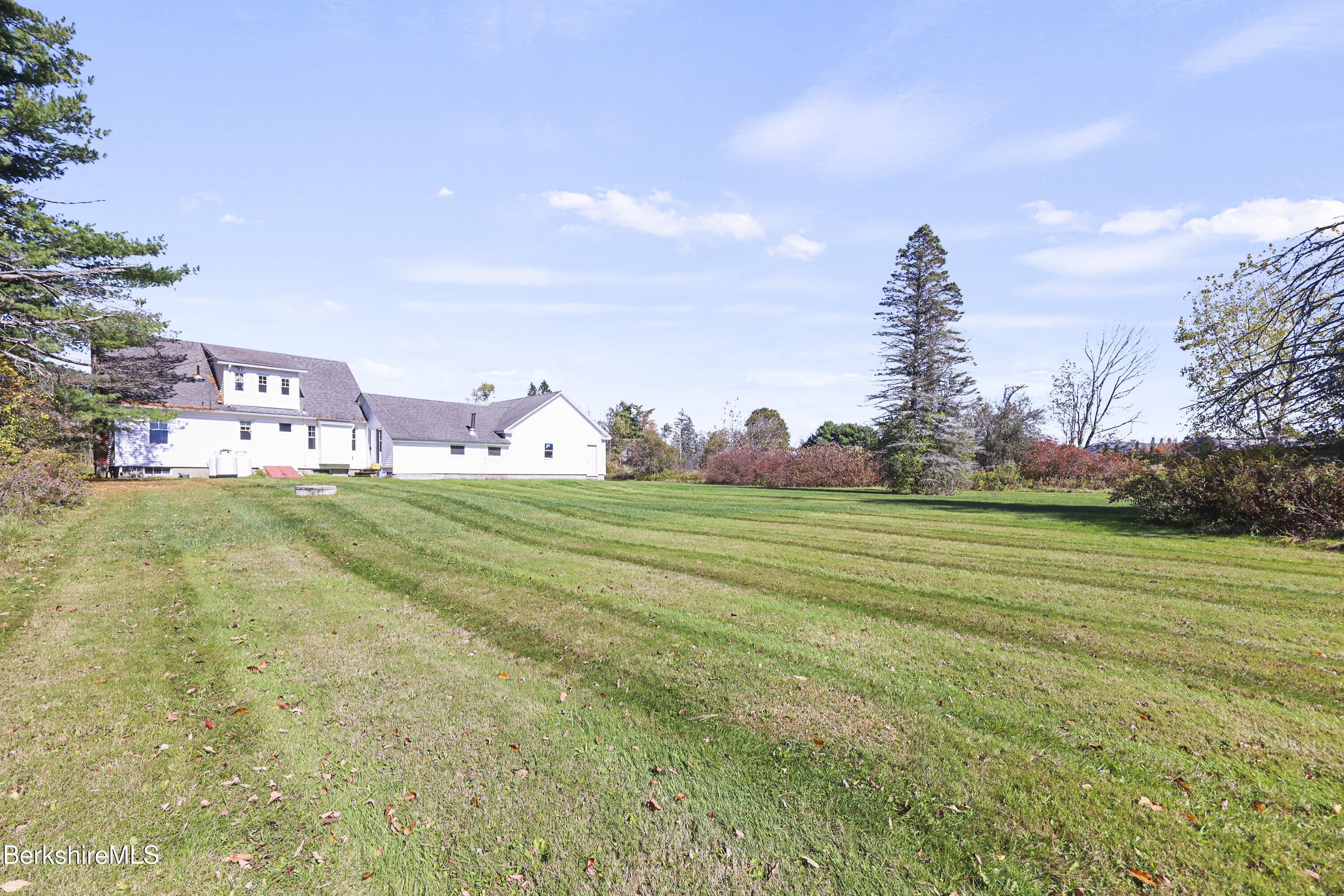 399 State Road Richmond, MA 01201 - Photo 37 of 43 a front view of a house with garden