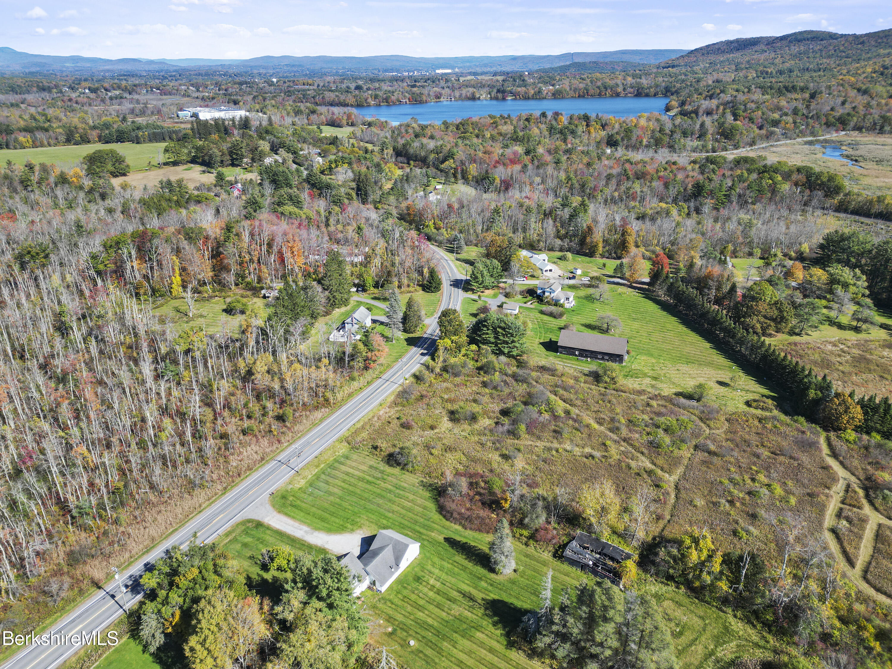 399 State Road Richmond, MA 01201 - Photo 4 of 43 a view of a city with lush green forest
