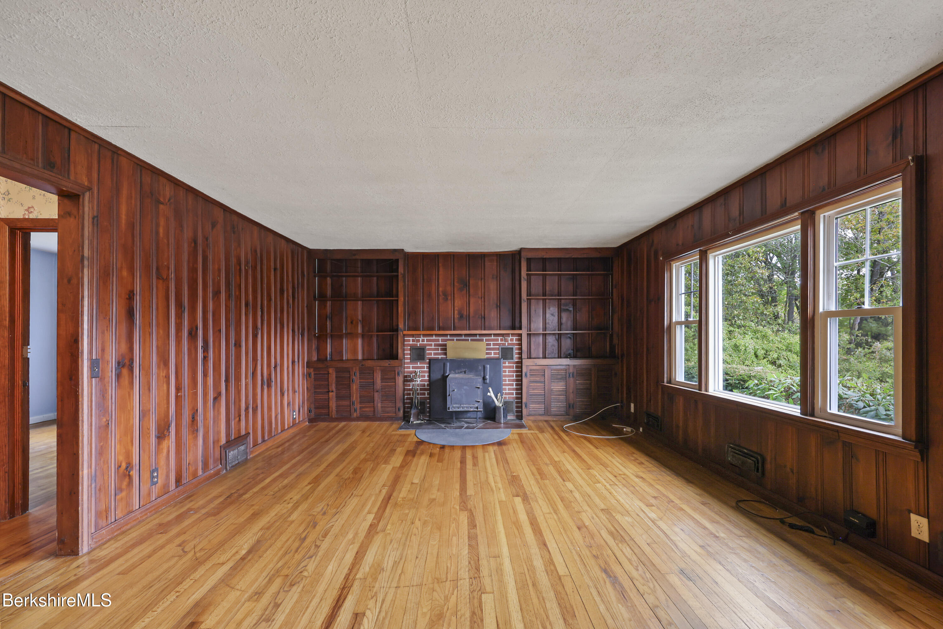 399 State Road Richmond, MA 01201 - Photo 10 of 43 a view of a livingroom with furniture window and wooden floor