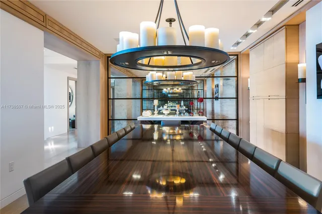 a living room with a table and chairs