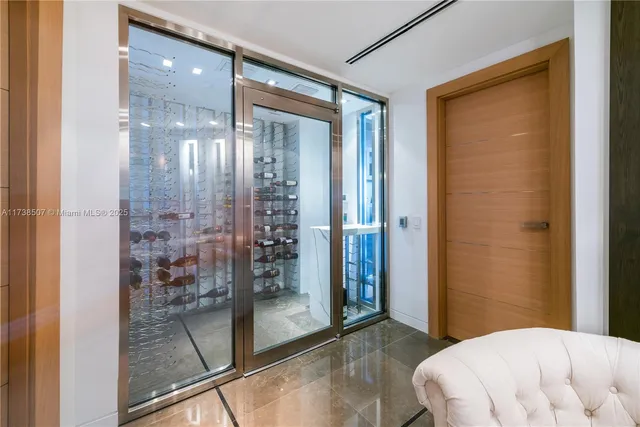 a bedroom with a balcony and a glass door shower