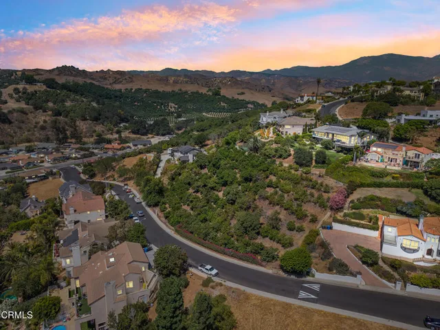 an aerial view of residential house and green space