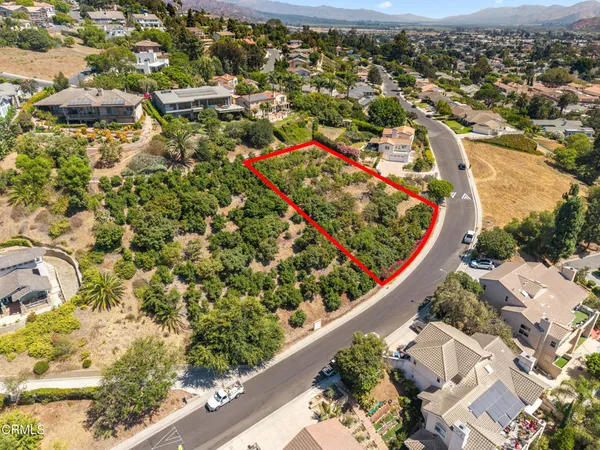 a view of a house with a flower garden