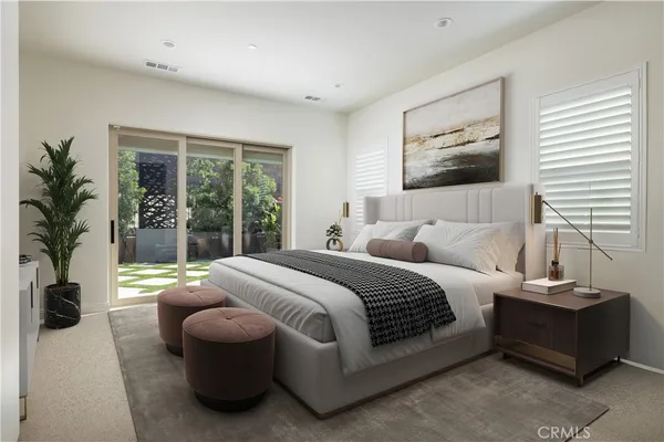 a spacious bedroom with a bed and a large window