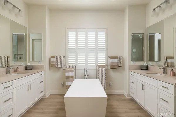 a large white kitchen with a large window
