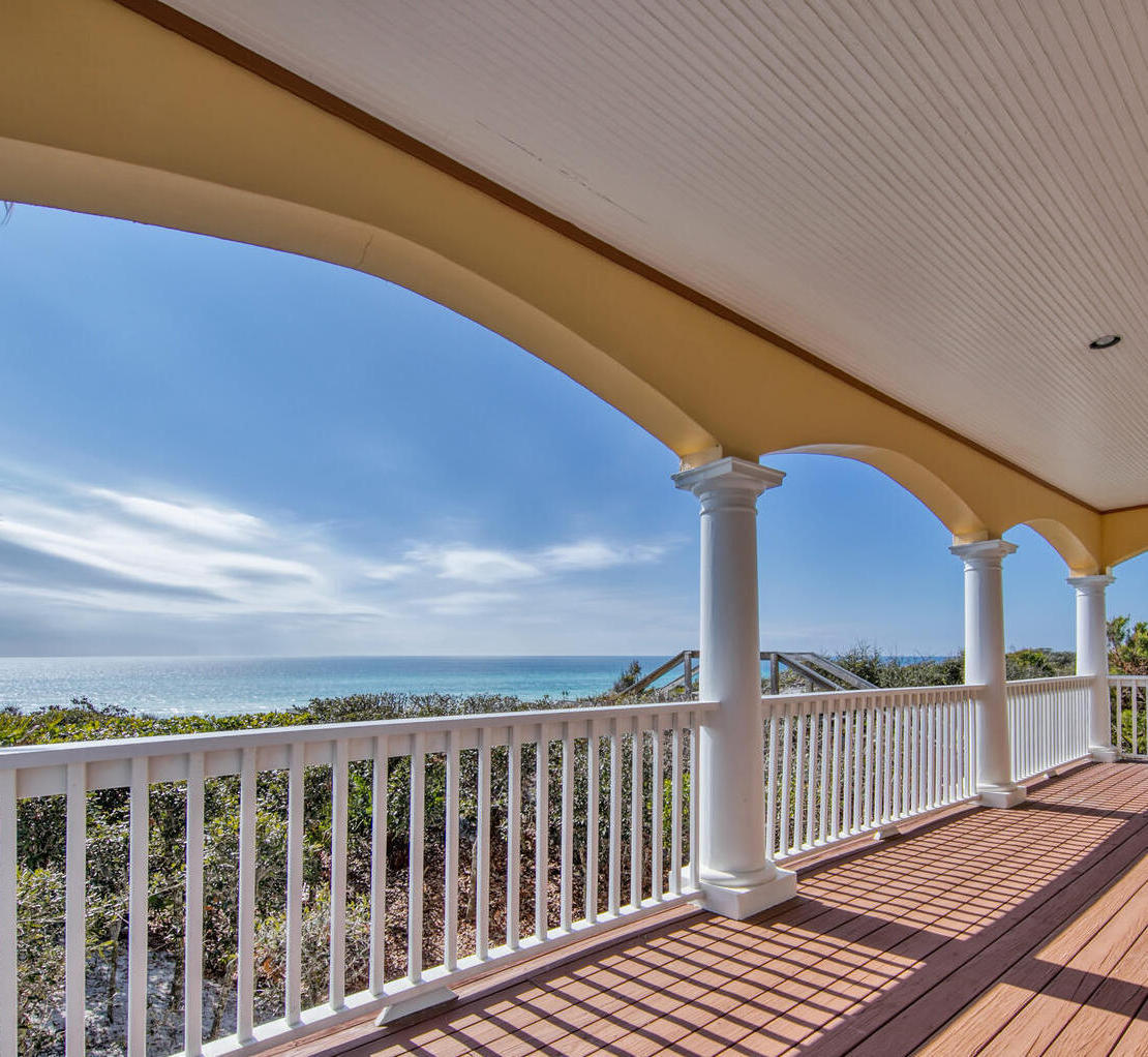 a view of balcony with wooden floor