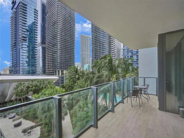 a view of a balcony with chairs