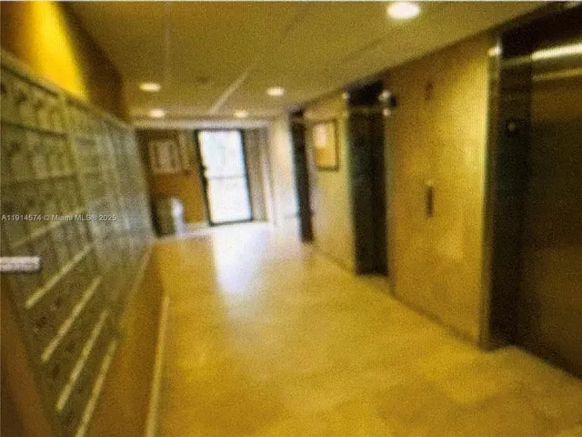 a view of a yellow room with a bathroom