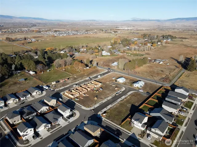 an aerial view of a city with ocean
