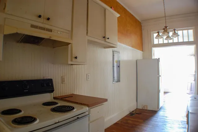 a living room with a fireplace and a window