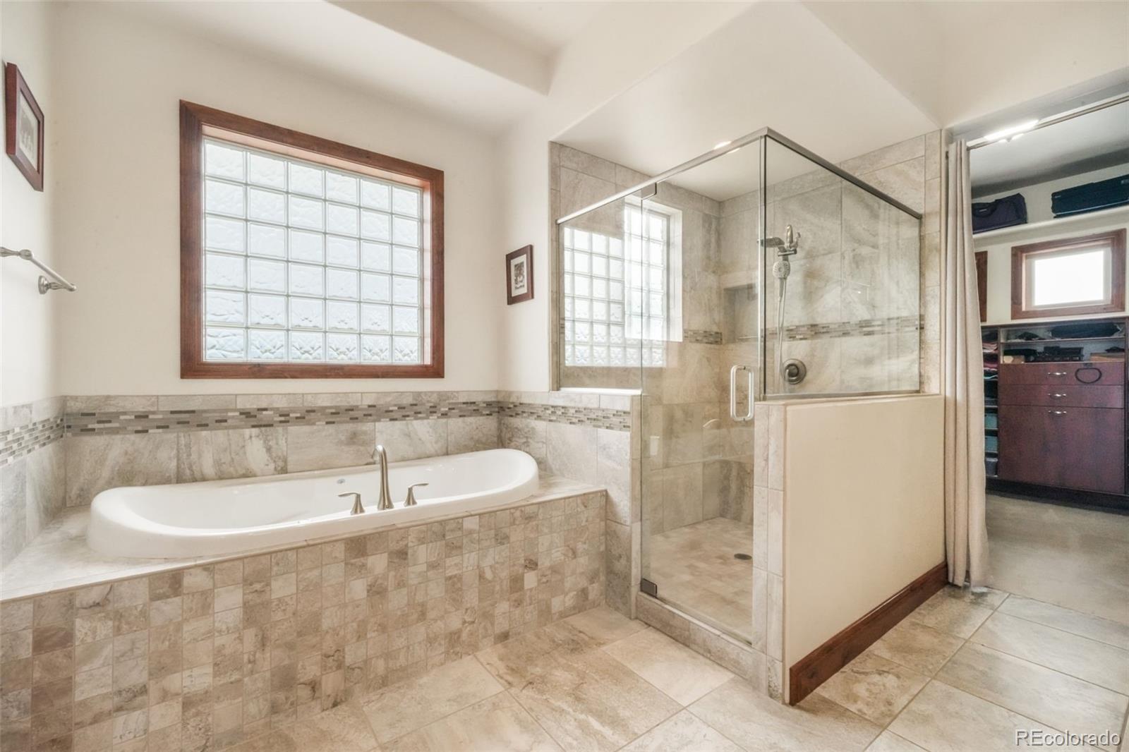 4330 Settlers Ranch Road Colorado Springs, CO 80908 - Photo 21 of 50 a spacious bathroom with a bathtub and a sink