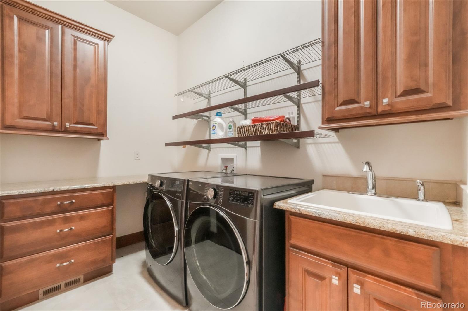 4330 Settlers Ranch Road Colorado Springs, CO 80908 - Photo 26 of 50 a utility room with dryer and washer