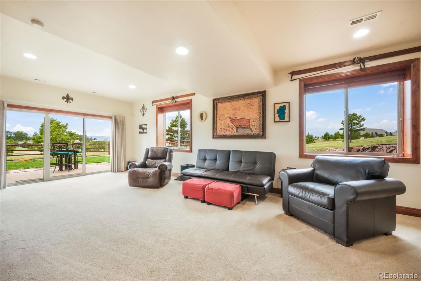 4330 Settlers Ranch Road Colorado Springs, CO 80908 - Photo 35 of 50 a living room with furniture ceiling fan and a large window