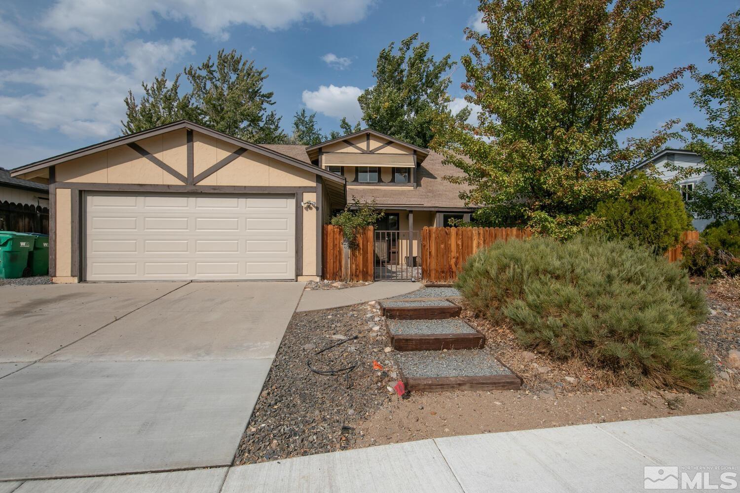 1675 Kings Row Reno, NV 89503 - Photo 1 of 32 front view of a house with a yard