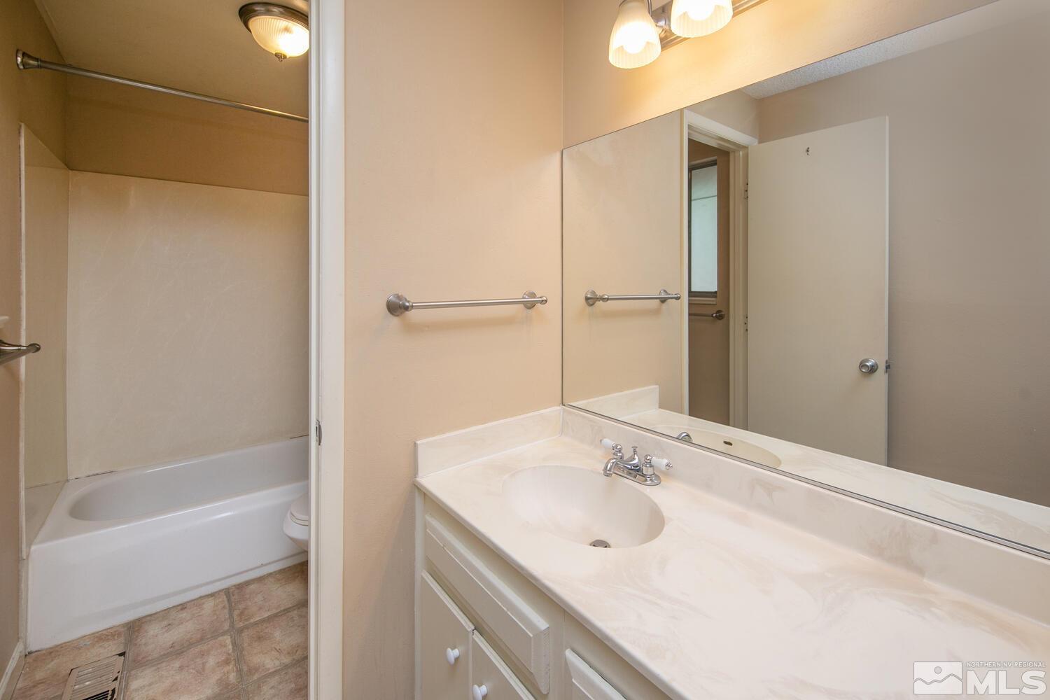 1675 Kings Row Reno, NV 89503 - Photo 16 of 32 a bathroom with a sink and a bathtub