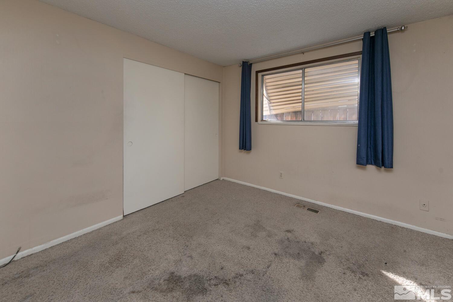 1675 Kings Row Reno, NV 89503 - Photo 19 of 32 a view of an empty room with a window