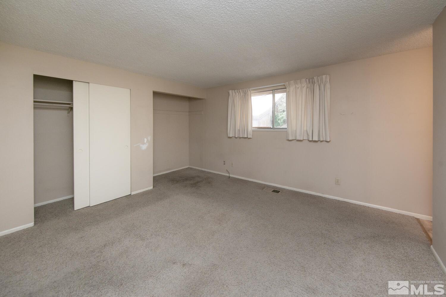 1675 Kings Row Reno, NV 89503 - Photo 21 of 32 a view of an empty room with a window