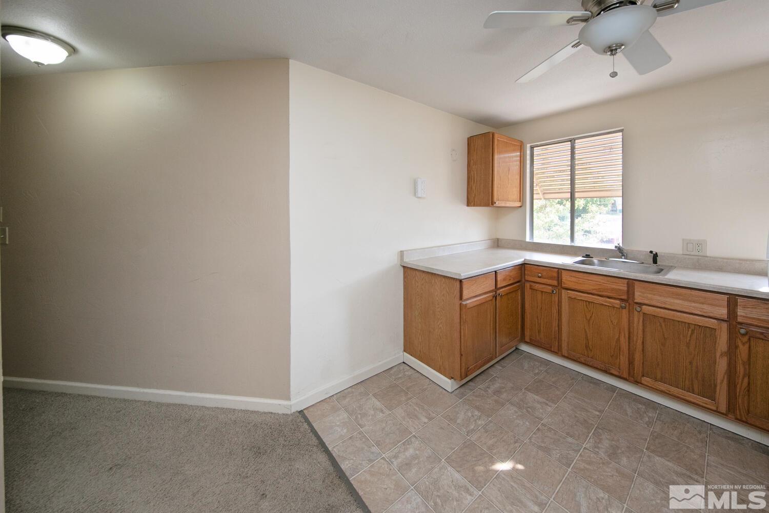 1675 Kings Row Reno, NV 89503 - Photo 27 of 32 a kitchen with a sink cabinets and window