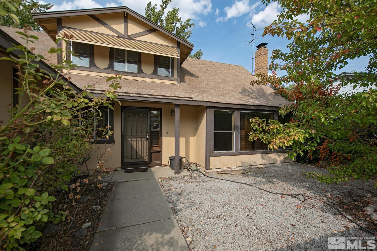 1675 Kings Row Reno, NV 89503 - Photo 3 of 32 a front view of a house with a garden