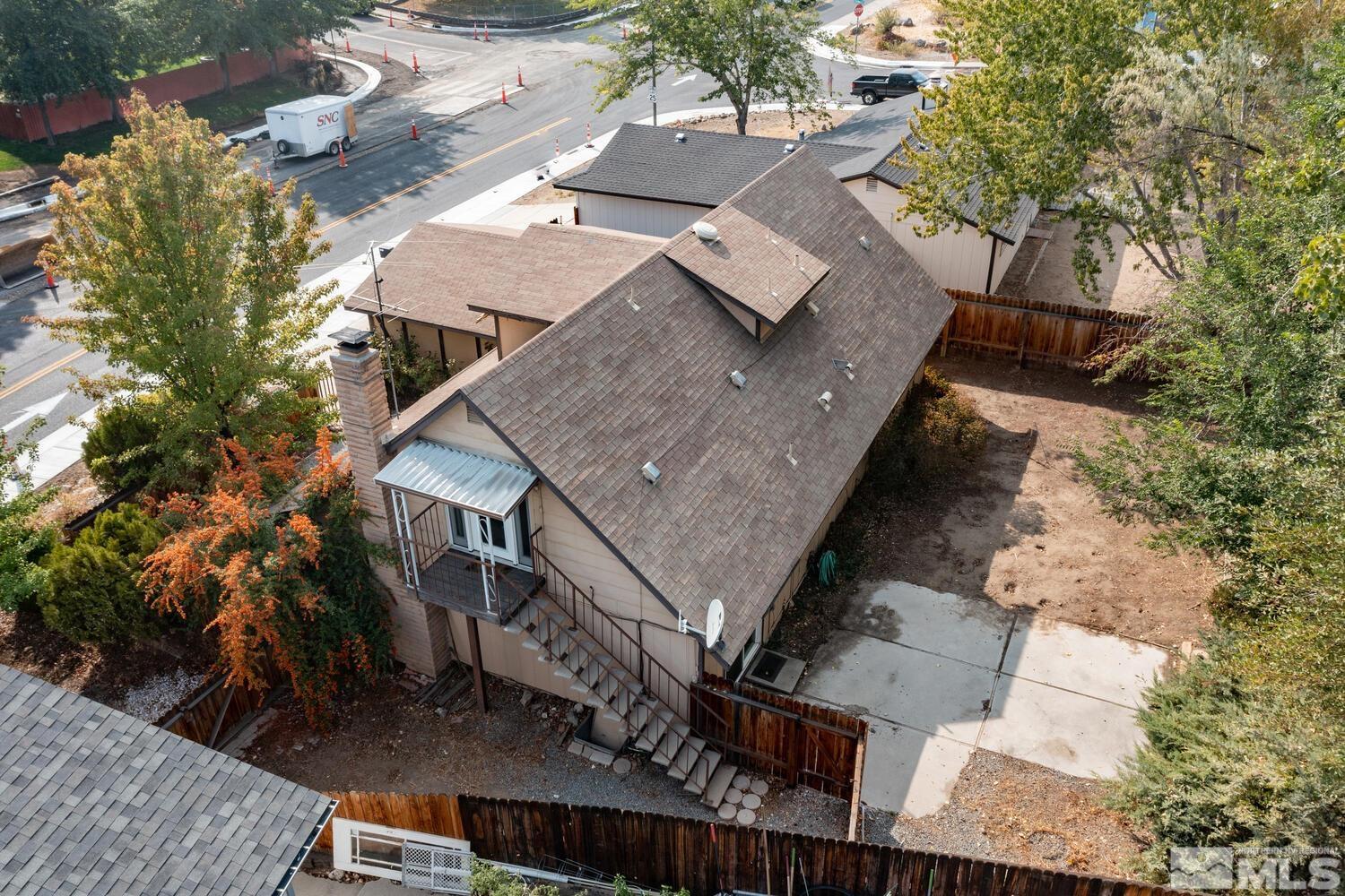 1675 Kings Row Reno, NV 89503 - Photo 4 of 32 an aerial view of a house with a yard