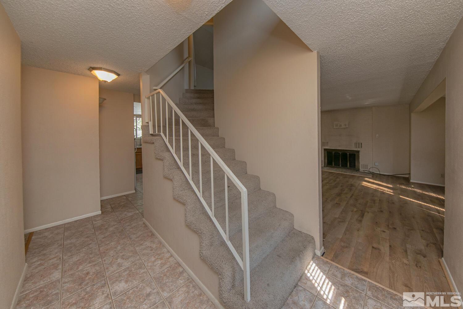 1675 Kings Row Reno, NV 89503 - Photo 8 of 32 a view of a hallway with staircase
