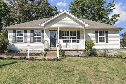 front view of a house with a yard