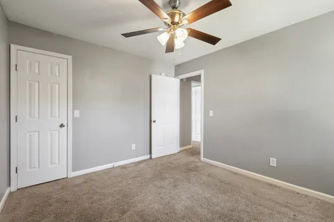a view of a balcony with wooden floor