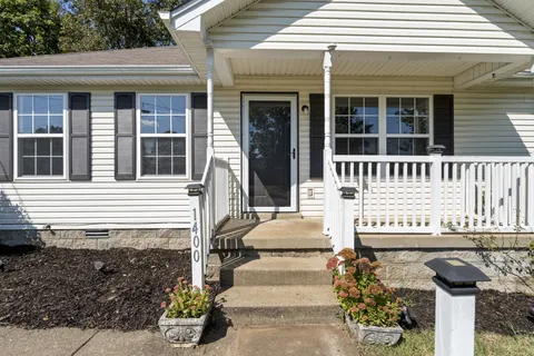 front view of a house with a bench