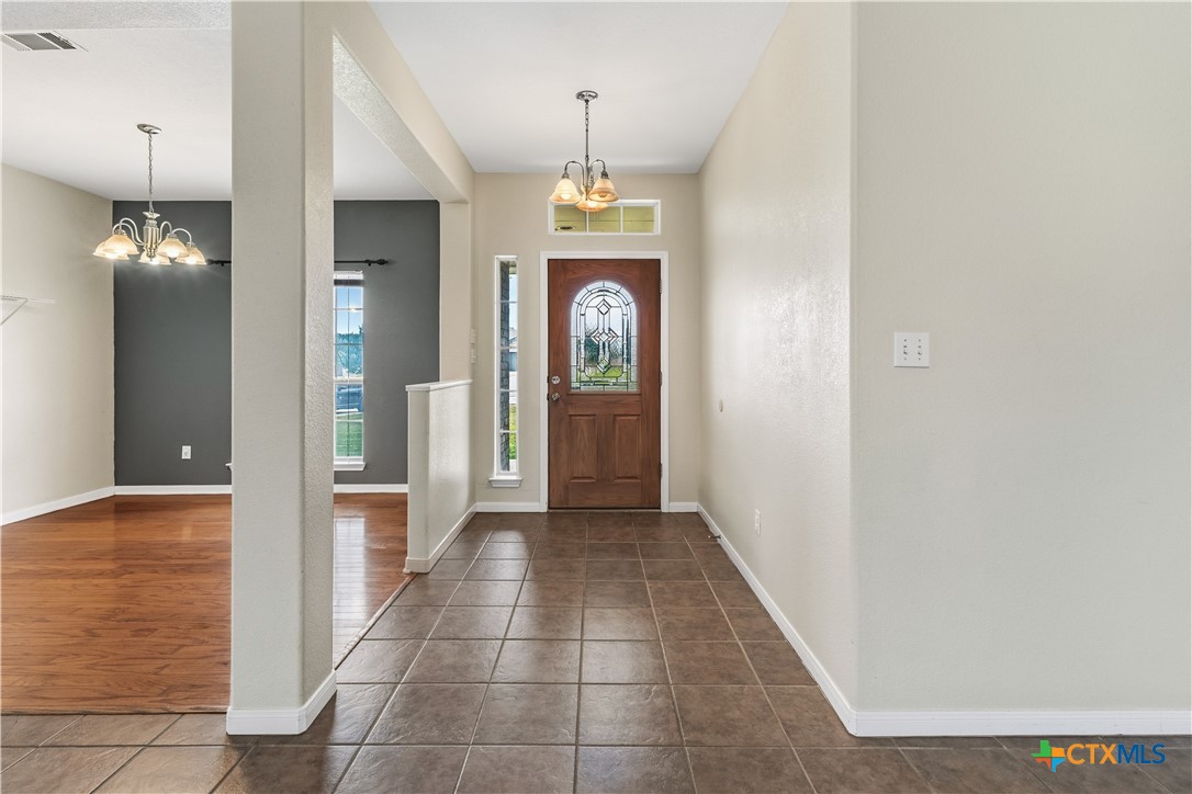 283 County Road 4710 Kempner, TX 76539 - Photo 4 of 47 a view of a hallway with a chandelier