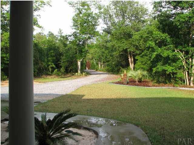 6417 Brigadier Road Milton, FL 32570 - Photo 23 of 25 View from the covered front porch. Home is very private, located on just over an acre lot.