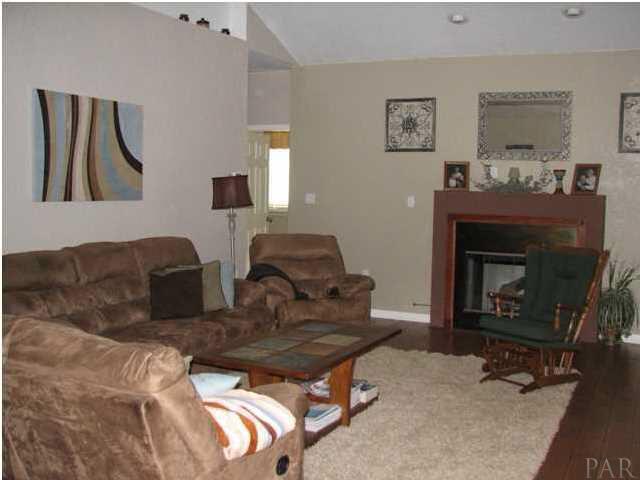 6417 Brigadier Road Milton, FL 32570 - Photo 3 of 25 Spacious living room with gas fireplace and more of those dupont floors. Love the floors very durable yet very modern and beautiful.