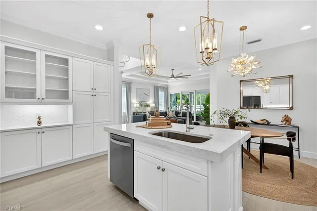 a kitchen with cabinets a sink and appliances
