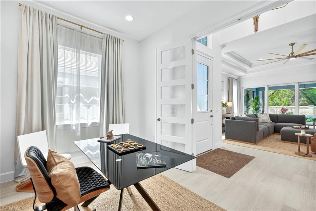 8877 Yucatan Court Naples, FL 34113 - Photo 15 of 29 a living room with furniture and a large window