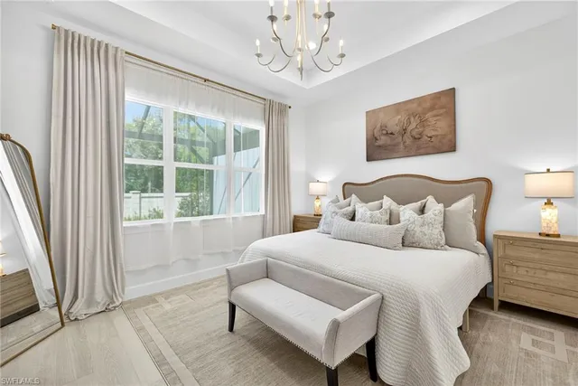 a bedroom with bed and a window