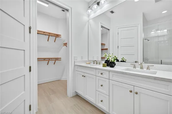 a bathroom with a sink and mirror