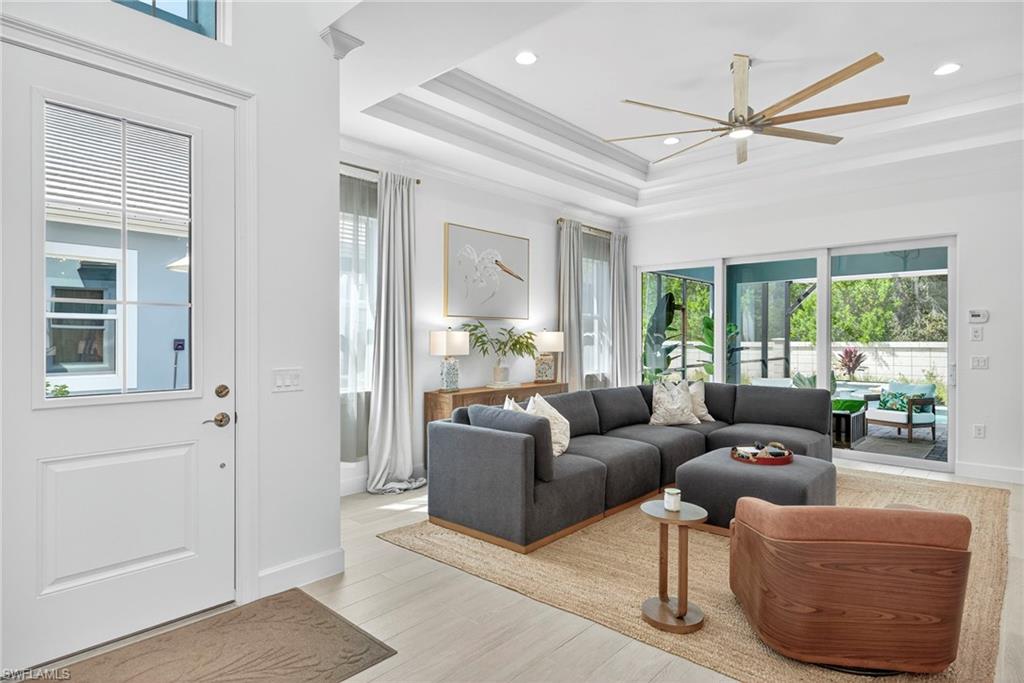 8877 Yucatan Court Naples, FL 34113 - Photo 2 of 29 a living room with furniture and a window